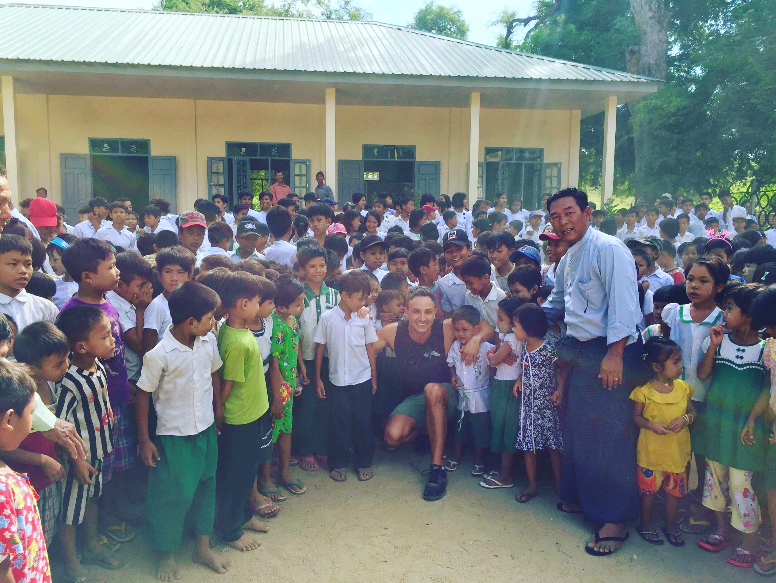 The community gathered outside a Hark Angels school in Myanmar