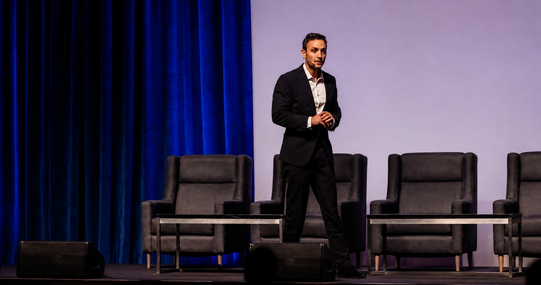 Richie Harkham speaking on stage